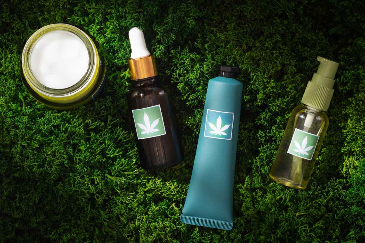 Four skincare products featuring cosmetic treatment product labels and packaging.